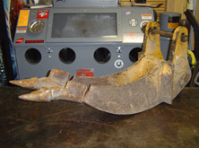 Backhoe Cribbing Bucket Before Repair with Ripped Cutting Edge